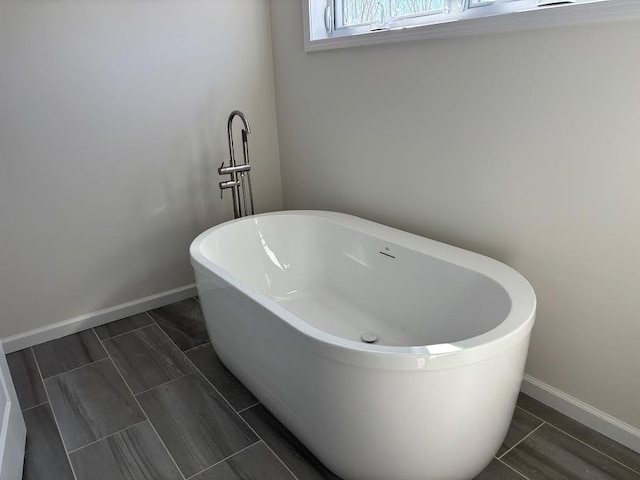 bathroom with a washtub