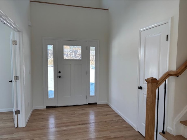 entryway with light hardwood / wood-style flooring