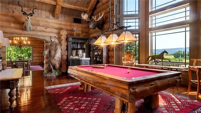 game room with beam ceiling, log walls, dark hardwood / wood-style floors, wood ceiling, and pool table