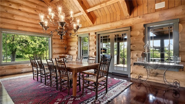 dining room with beamed ceiling and a healthy amount of sunlight