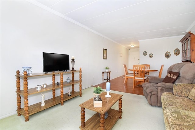 living room with carpet floors and ornamental molding