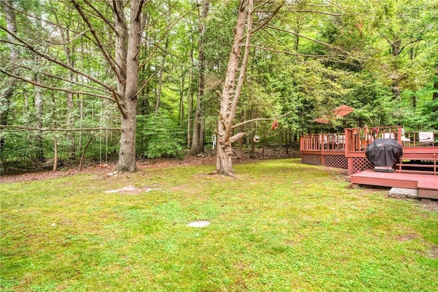 view of yard with a wooden deck