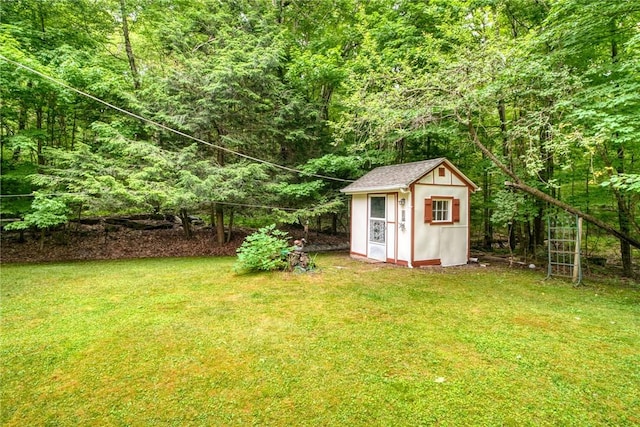 view of outbuilding featuring a lawn