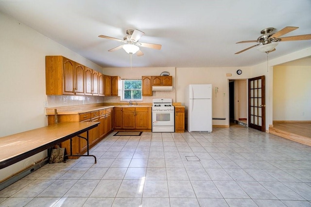 kitchen featuring ceiling fan, light tile patterned flooring, white appliances, and sink