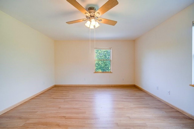 empty room with light wood-type flooring and ceiling fan