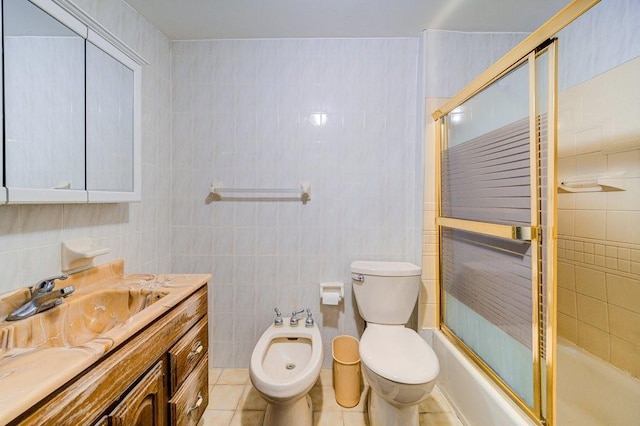 full bathroom featuring tile patterned floors, tile walls, and a bidet