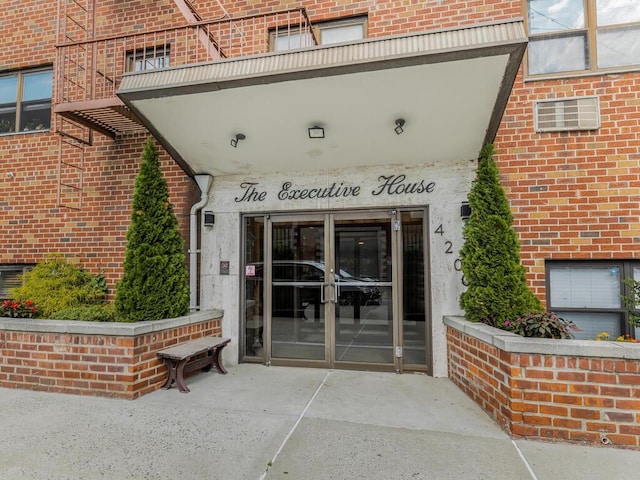 view of exterior entry featuring french doors