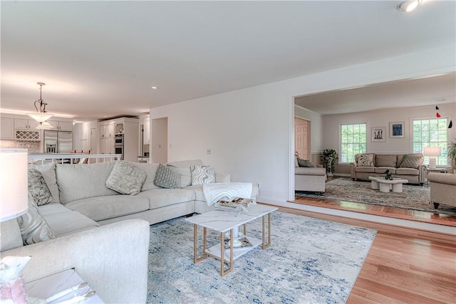 living room with light hardwood / wood-style floors