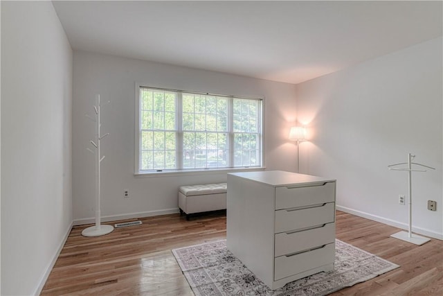 unfurnished room with light wood-type flooring