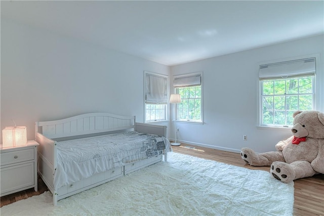 bedroom with light hardwood / wood-style floors