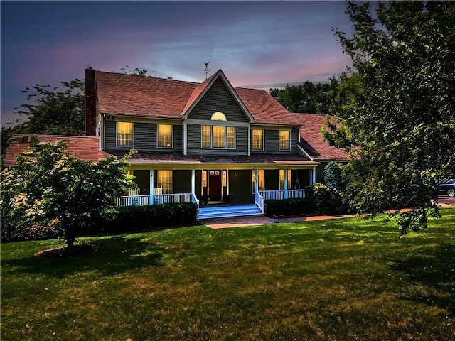 view of front of home featuring a yard and covered porch