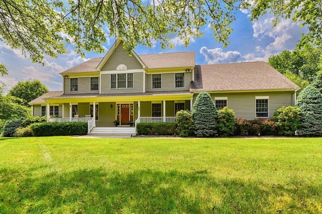 view of front of home with a porch and a front yard