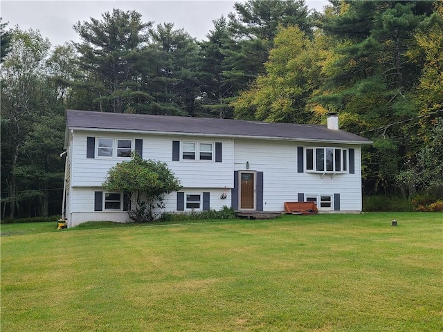 raised ranch featuring a front yard