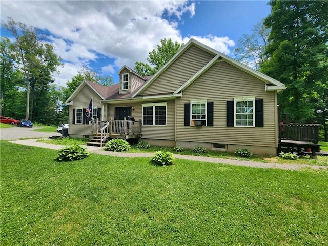 back of house with a lawn