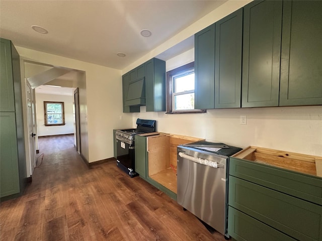 kitchen with green cabinets and stainless steel gas range oven