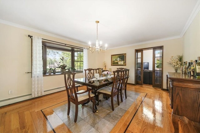 dining space featuring a notable chandelier, plenty of natural light, light wood-type flooring, and ornamental molding