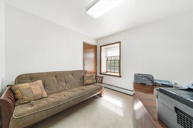 living room with a baseboard heating unit