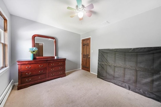 carpeted bedroom with ceiling fan and a baseboard radiator