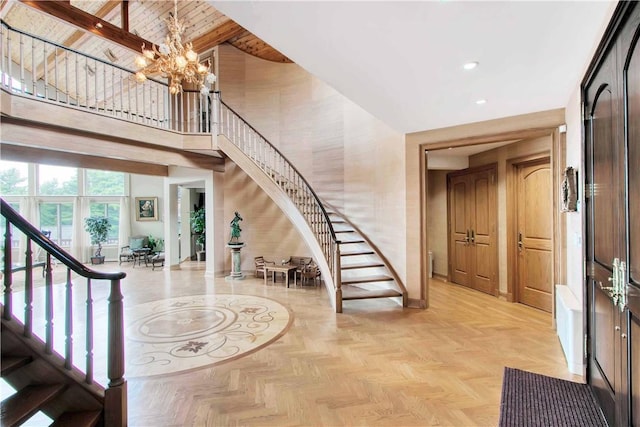 entrance foyer featuring an inviting chandelier, wood ceiling, high vaulted ceiling, beamed ceiling, and light parquet flooring