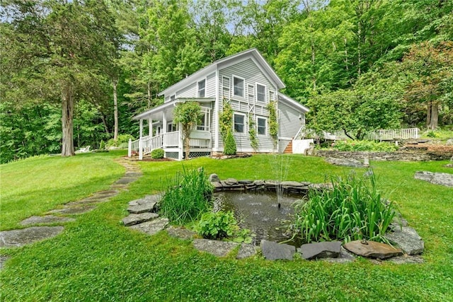 view of side of home featuring a yard