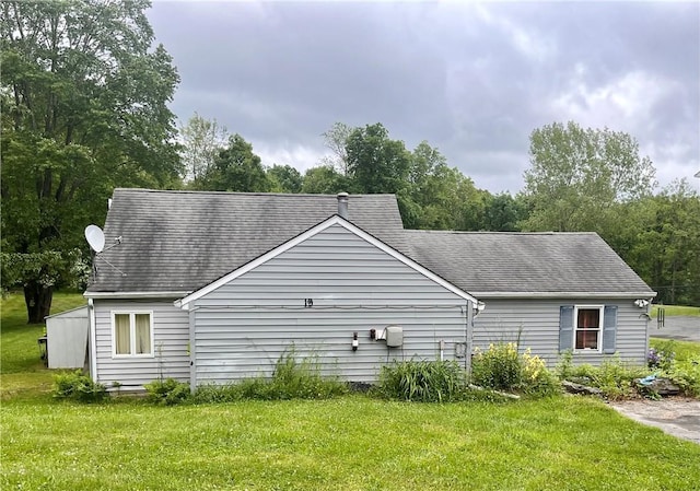 view of property exterior featuring a yard