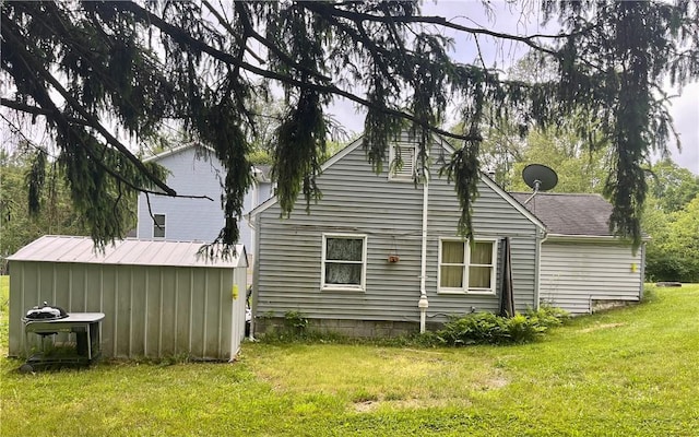 view of side of home featuring a lawn