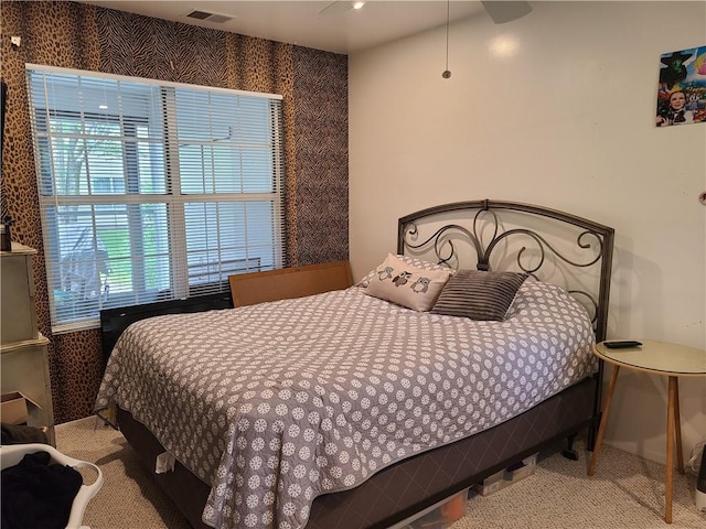 carpeted bedroom featuring ceiling fan