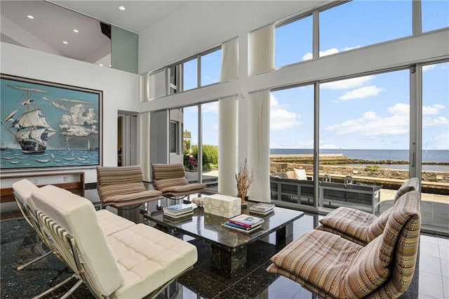 sunroom with a healthy amount of sunlight and a water view