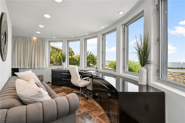 sunroom with a water view