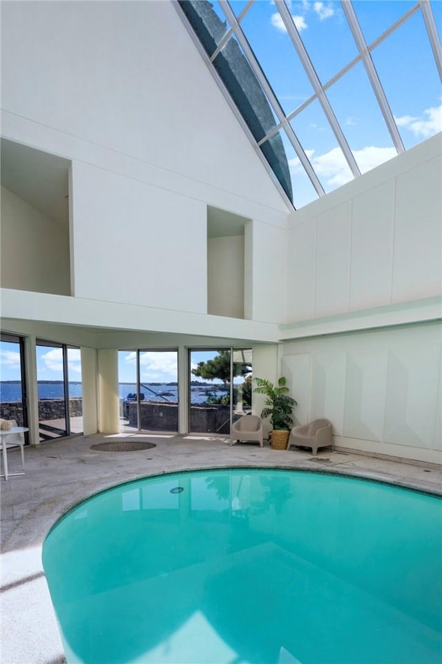 view of pool with a skylight