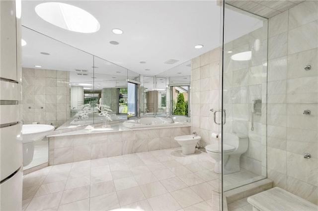 bathroom featuring shower with separate bathtub, tile patterned floors, a bidet, and tile walls