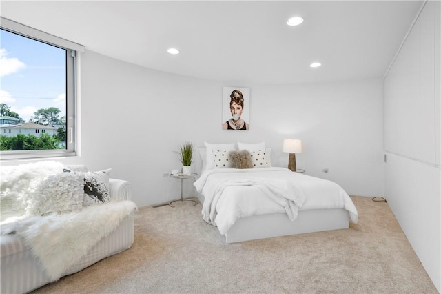 bedroom featuring light colored carpet