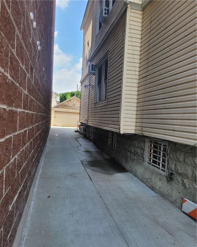 view of side of property featuring a garage and an outdoor structure