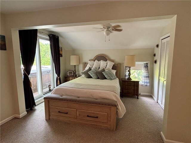 carpeted bedroom with access to exterior, ceiling fan, a closet, and lofted ceiling