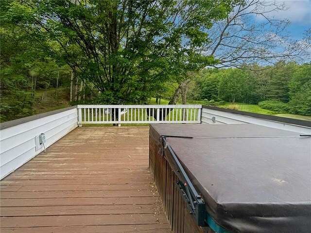 deck featuring a hot tub