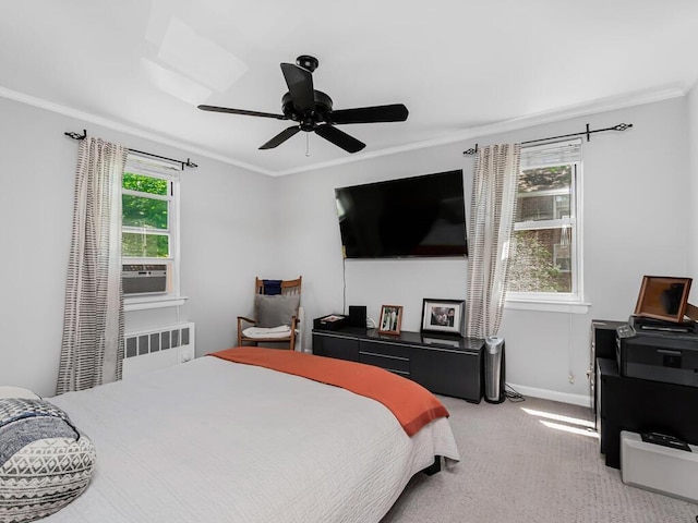 bedroom with multiple windows, radiator, crown molding, and ceiling fan