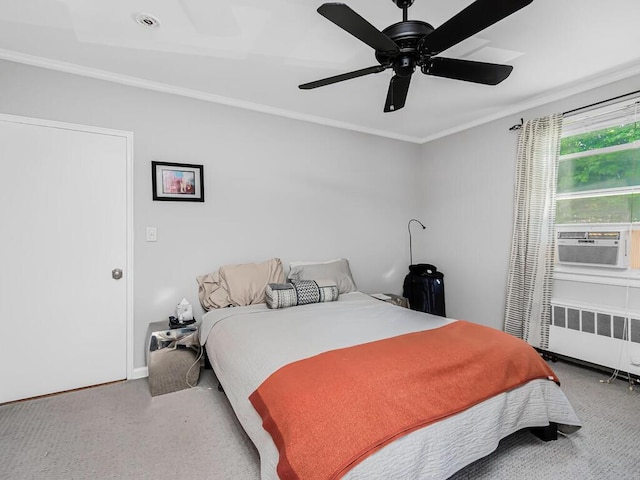 carpeted bedroom with ceiling fan, cooling unit, radiator heating unit, and ornamental molding