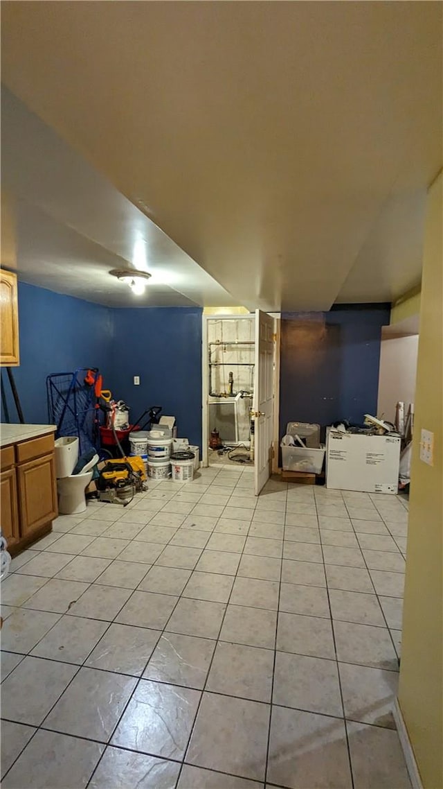 additional living space featuring light tile patterned floors