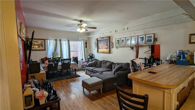 living room with hardwood / wood-style floors and ceiling fan