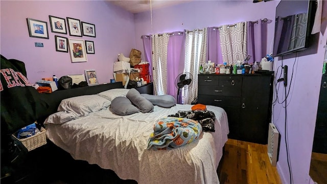 bedroom featuring dark hardwood / wood-style flooring