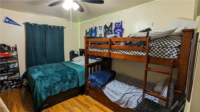 bedroom featuring ceiling fan and hardwood / wood-style floors