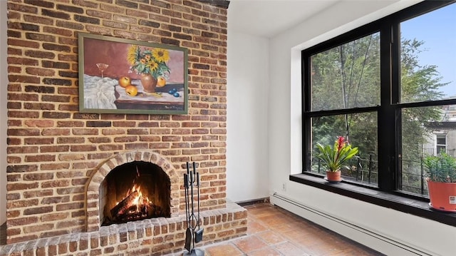 living room featuring a brick fireplace and a baseboard heating unit