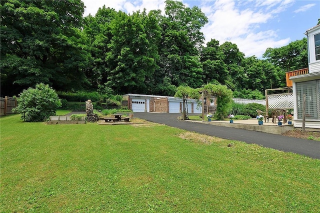 view of yard with a garage