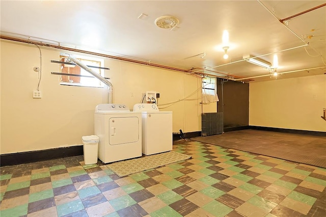 washroom with washer and dryer and a wealth of natural light