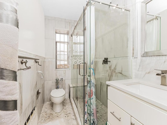 bathroom featuring toilet, vanity, tile walls, and walk in shower