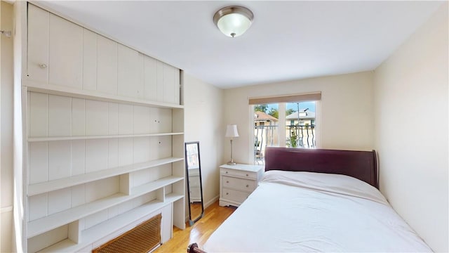 bedroom with light hardwood / wood-style flooring