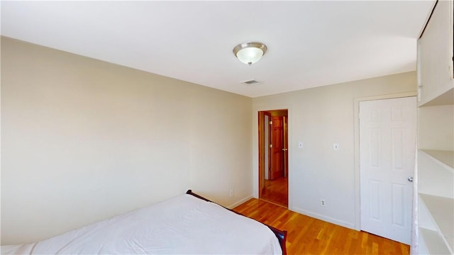 bedroom with light wood-type flooring