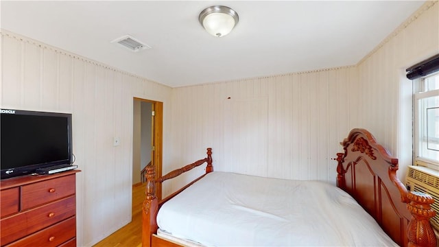 bedroom with light hardwood / wood-style floors