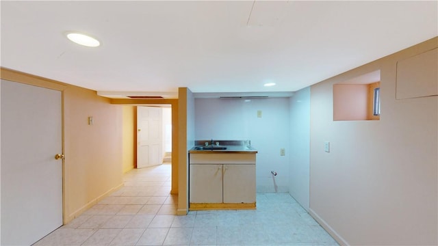 kitchen with light tile patterned flooring and sink