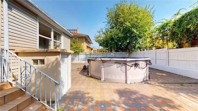 view of patio featuring a fenced in pool